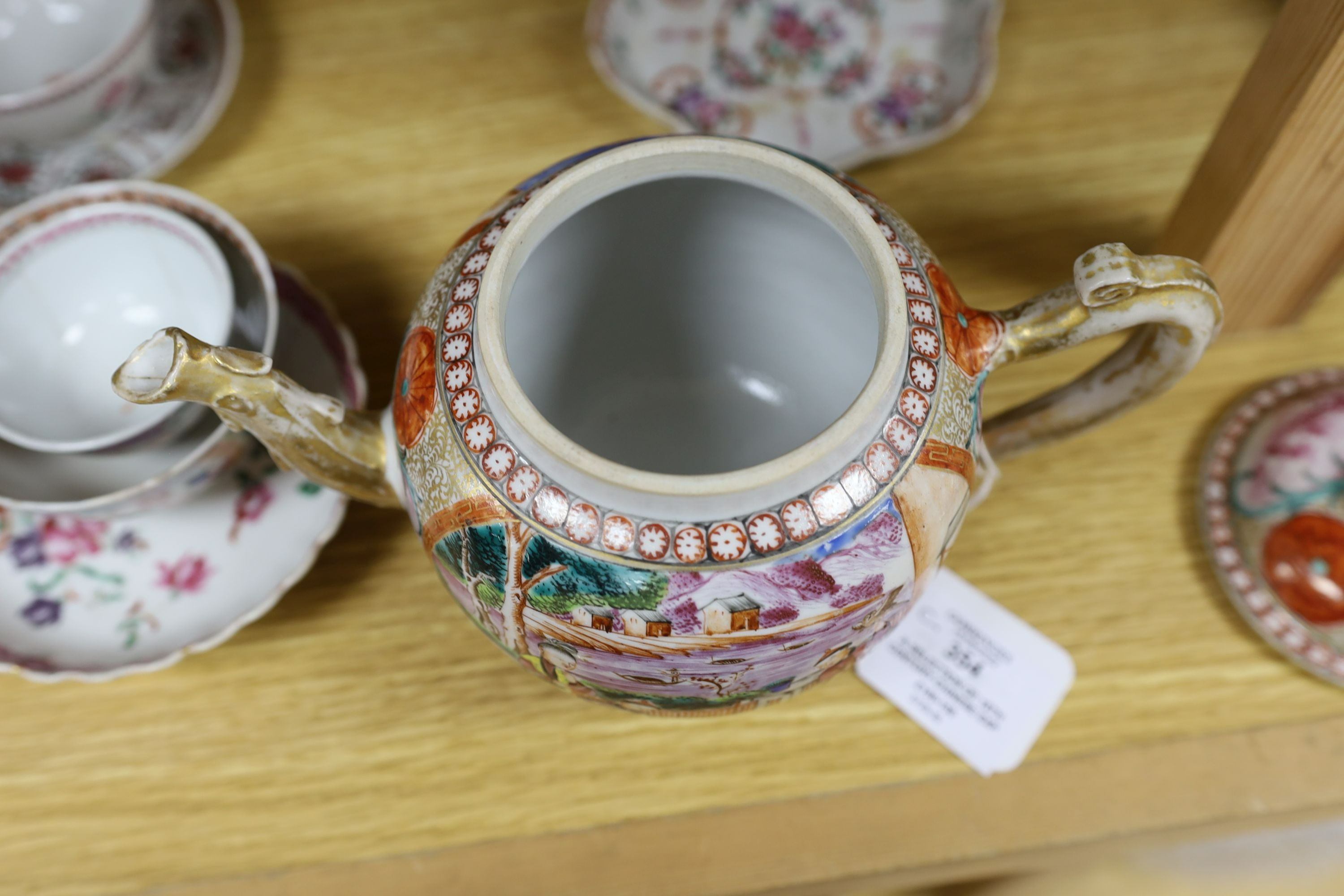 A selection of 18th century Chinese export wares, to include a teapot, tea bowls, saucers etc., some matching, tallest 16cm, (10)